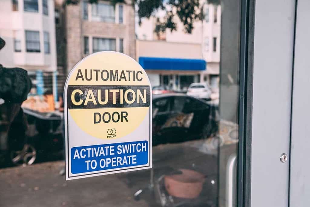 Automatic caution door sticker
