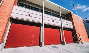 Red overhead metal doors installed for Fire House in San Francisco