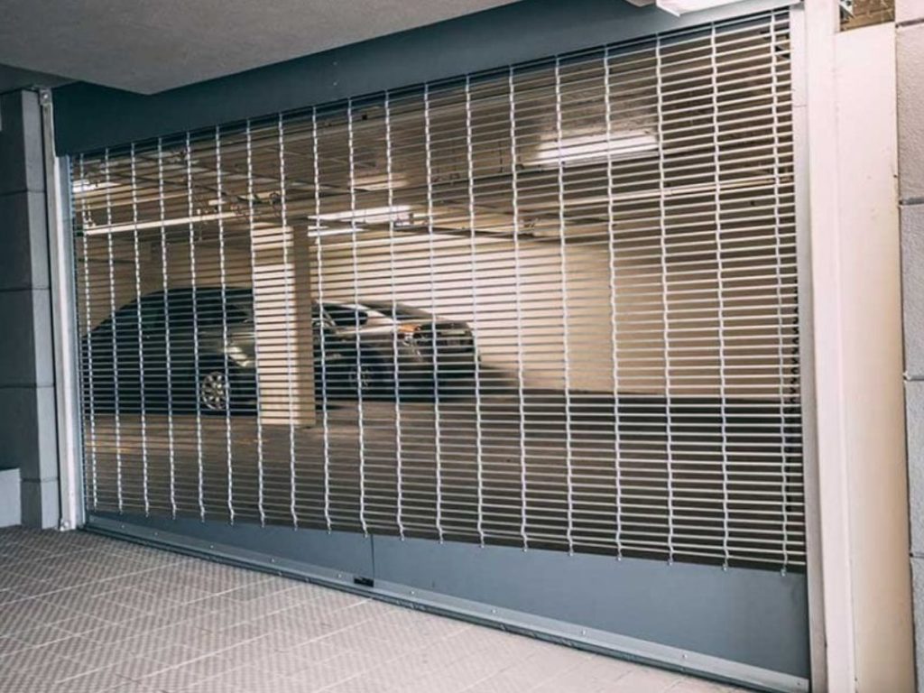 Security grille installation | The Best Parking Garage Door and Gate Options for Your Space | Union Door